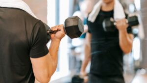 man lifting weights at gym