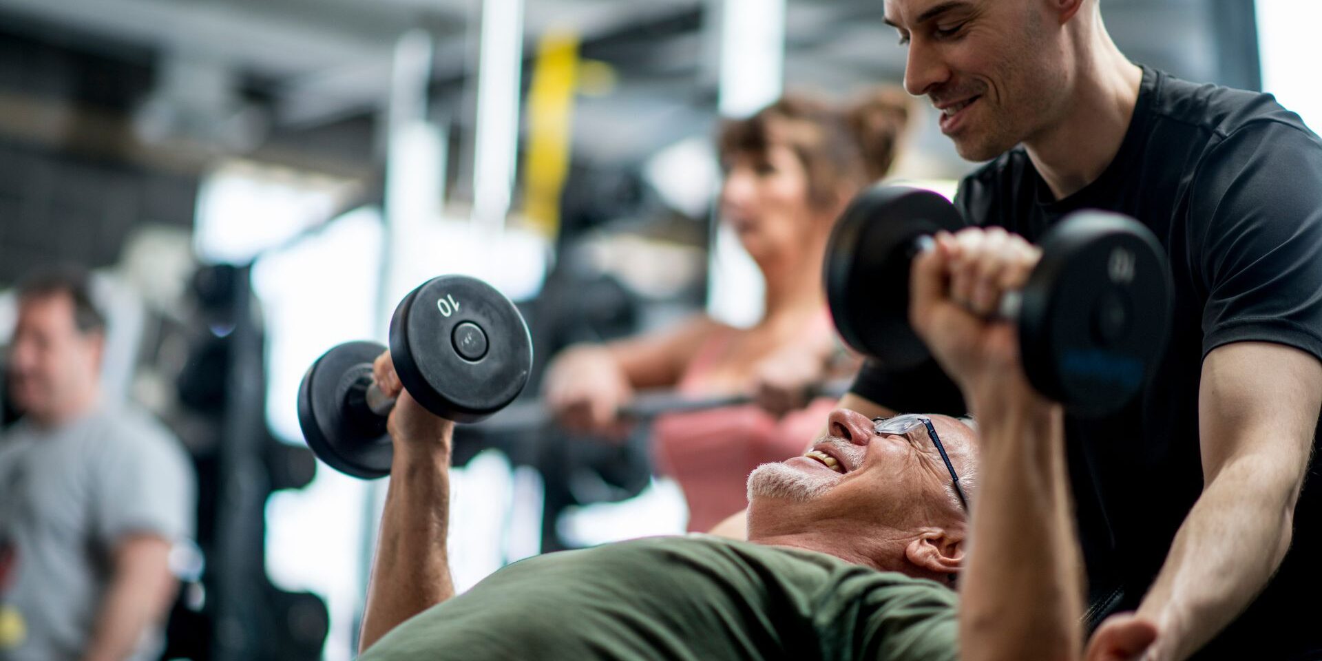 personal trainer working with student